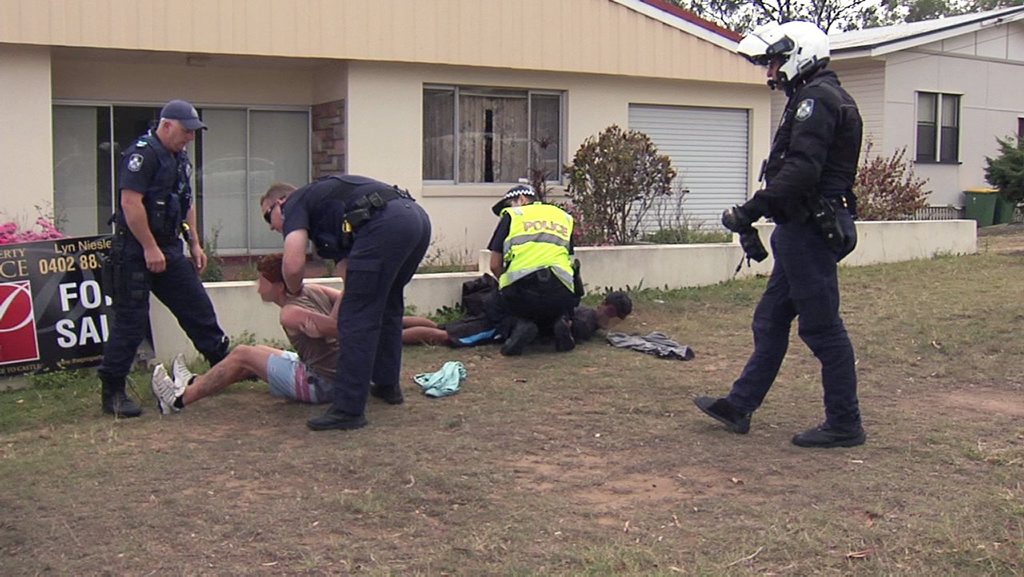 Police detain some youths in North Ipswich after chase through Ipswich on Tuesday. Photo: Terry Royan Police detain some youths in North Ipswich after chase through Ipswich on Tuesday. Photo: Terry Royan